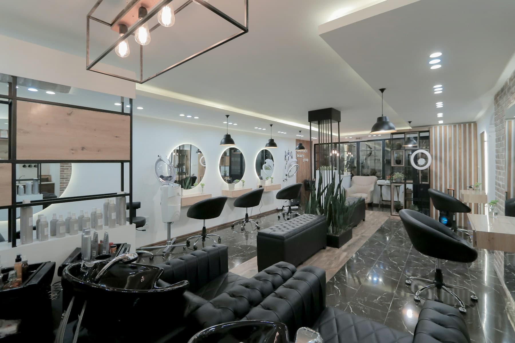 RayDaniel reception with stone wall and chandelier